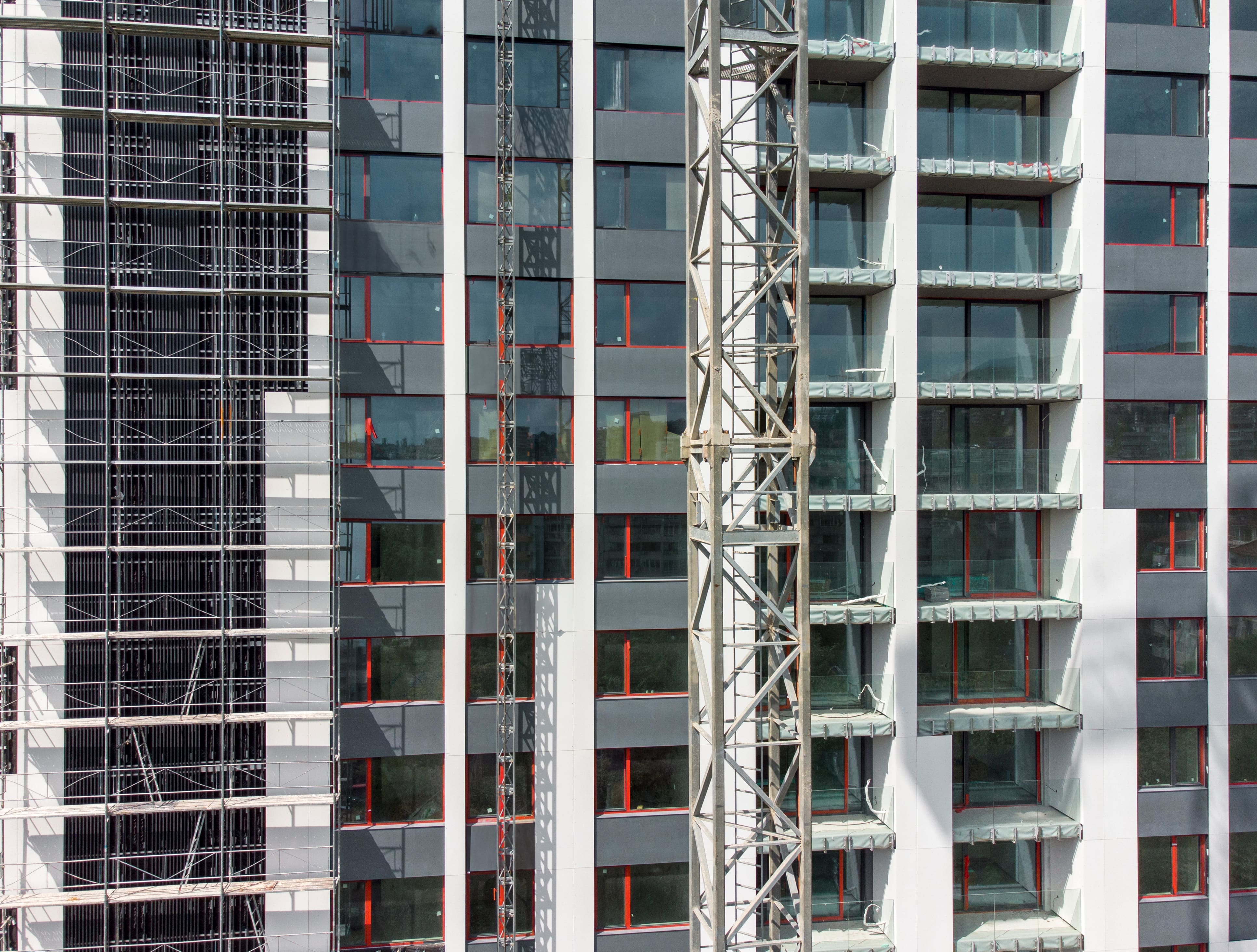 Scaffolding on apartment building facade construction project